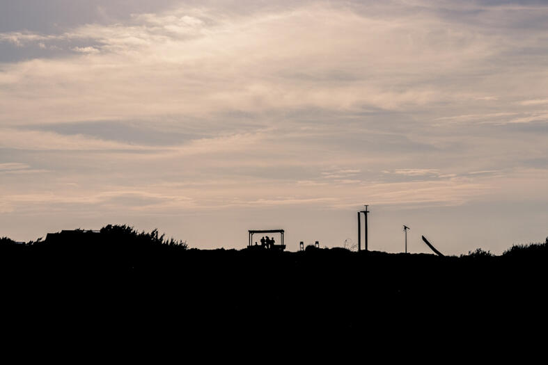 A gathering in silhouette.